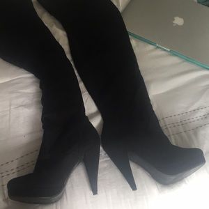 Tall black heeled boots
